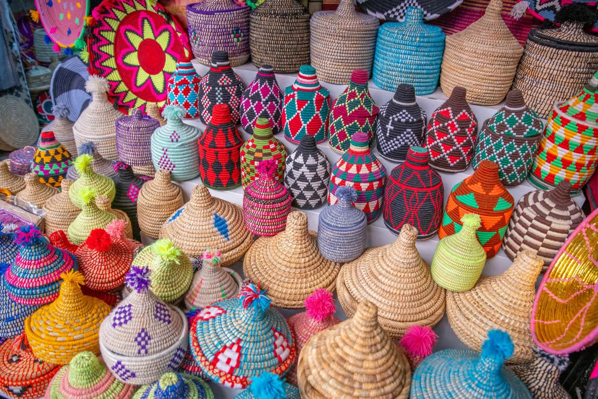 Colourful handwoven Ghanaian craft baskets at market